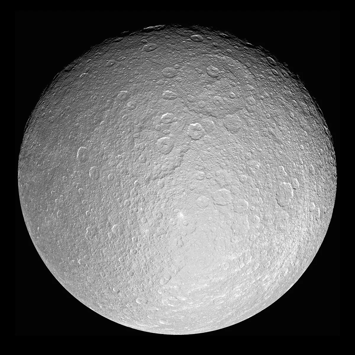 The Cassini spacecraft looks toward the cratered plains of the trailing hemisphere of Rhea by NASA