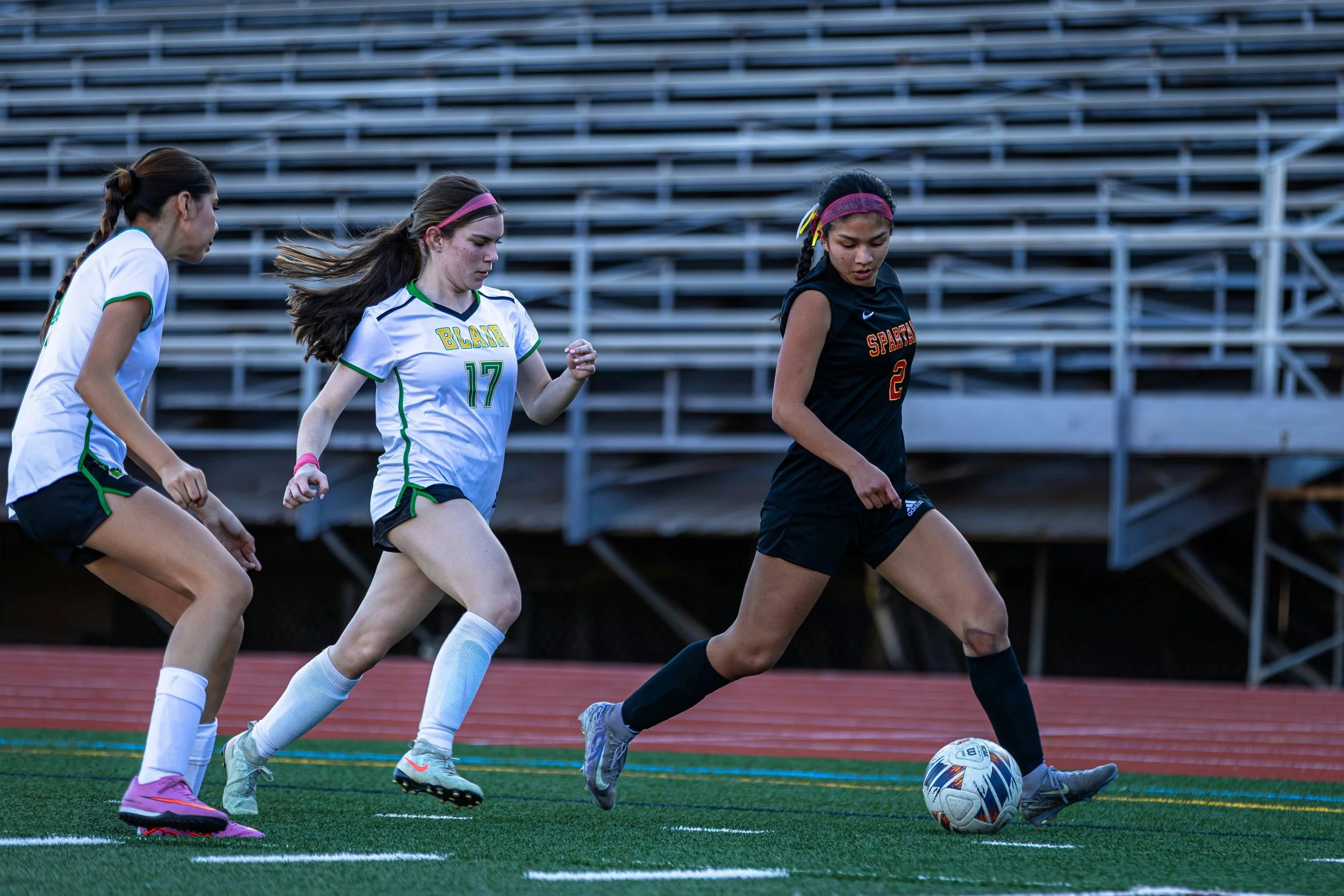 Teen girls playing soccer