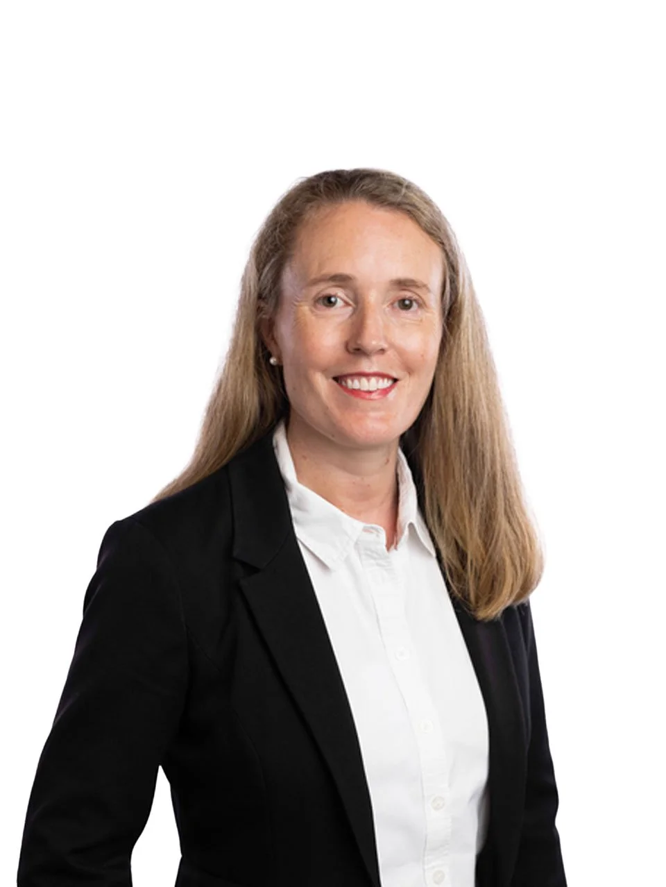 A woman with long blonde hair, wearing a black blazer and white shirt, smiling against a plain white background.