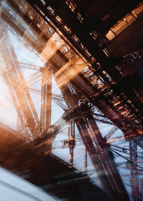 A complex view of industrial steel structures and cranes with a layered, abstract appearance.