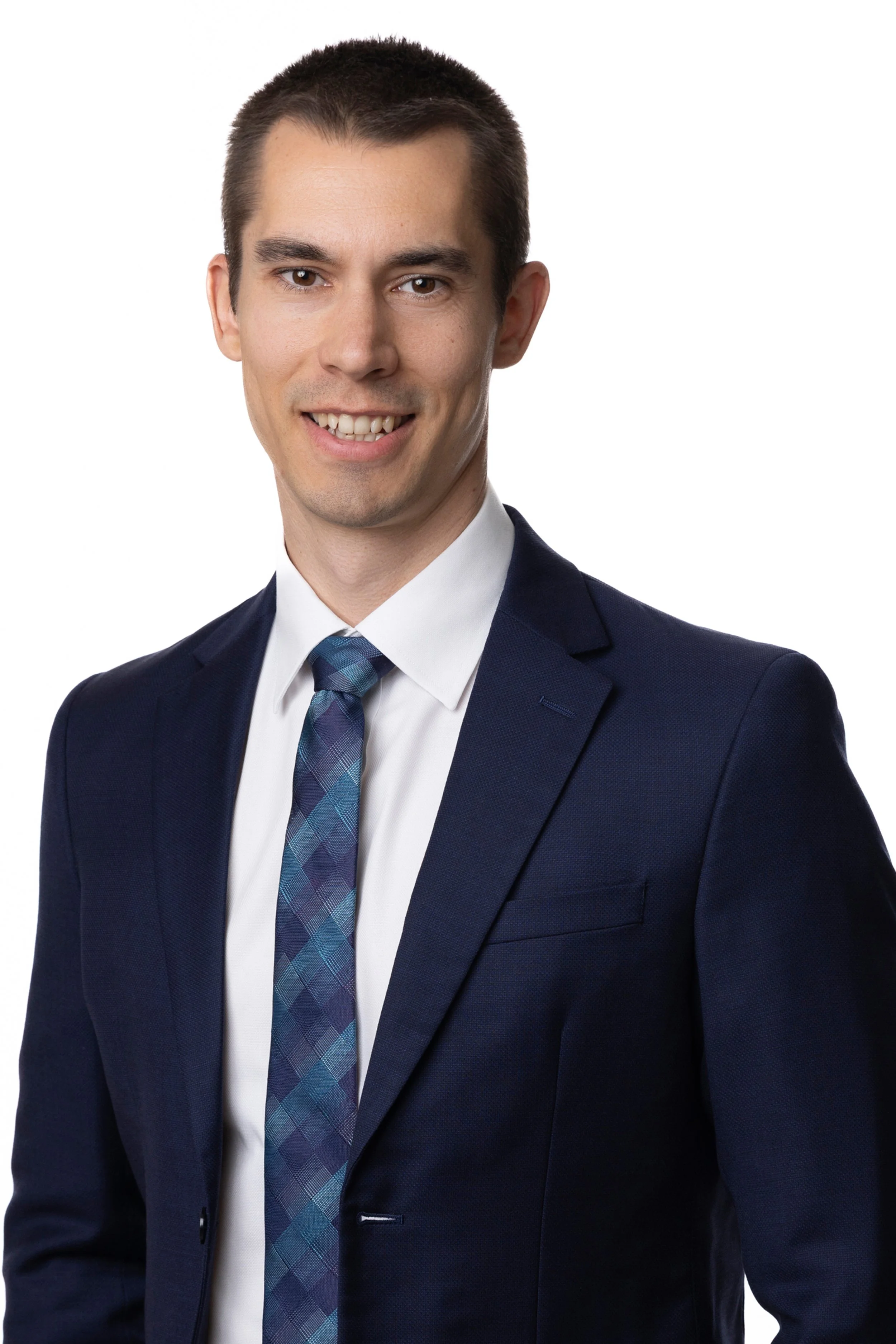 Professional male smiling against a white background