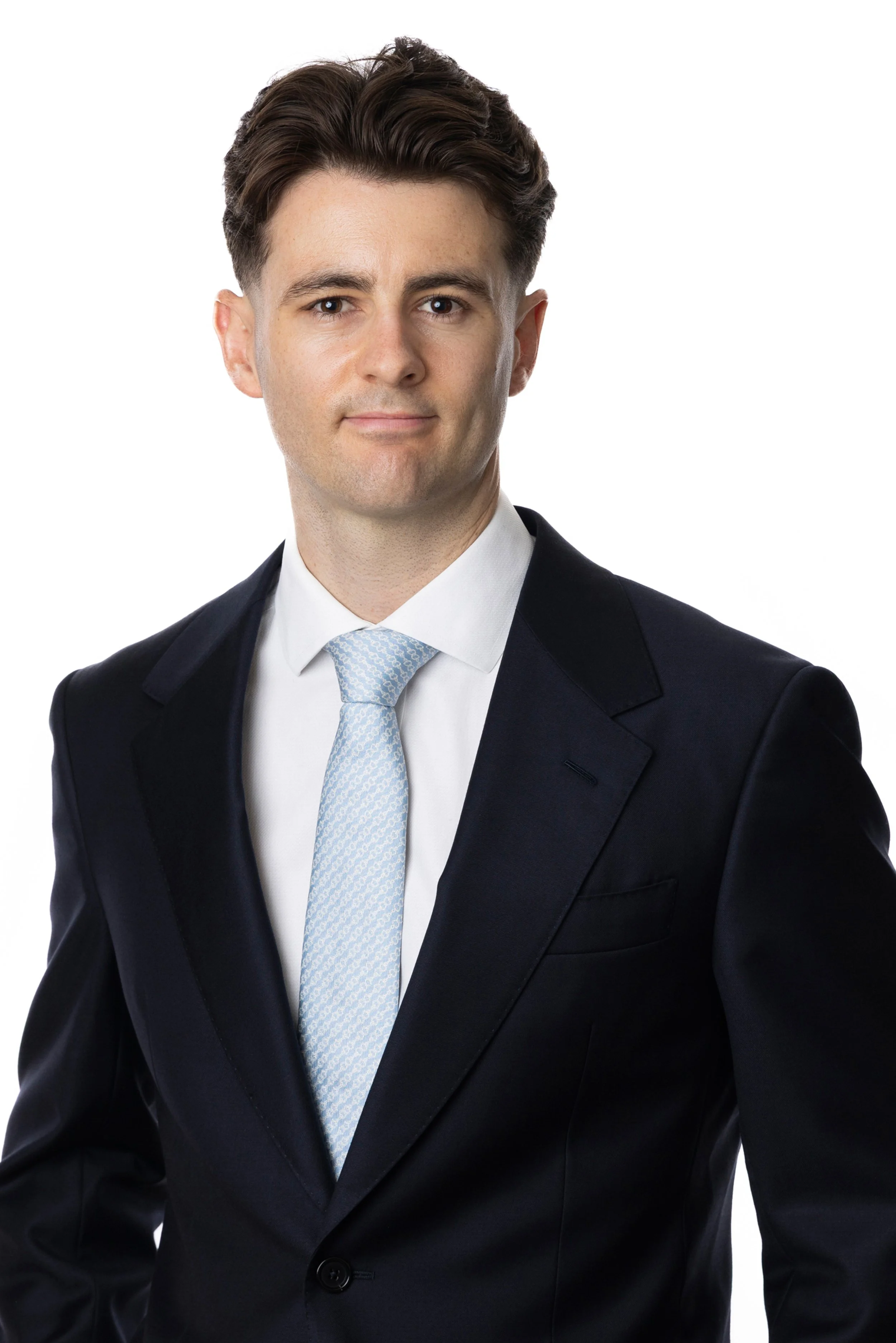 Chris Jones -  an investment associate in a dark suit with light blue tie.