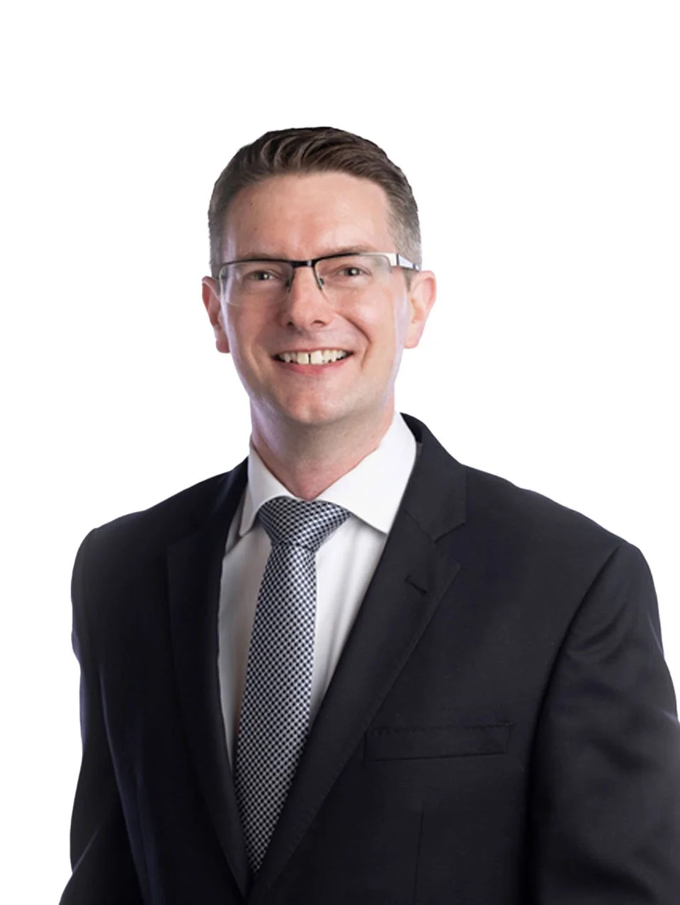 Nathan Clearly,  in a black suit, white shirt, and patterned tie, wearing glasses, against a white background.