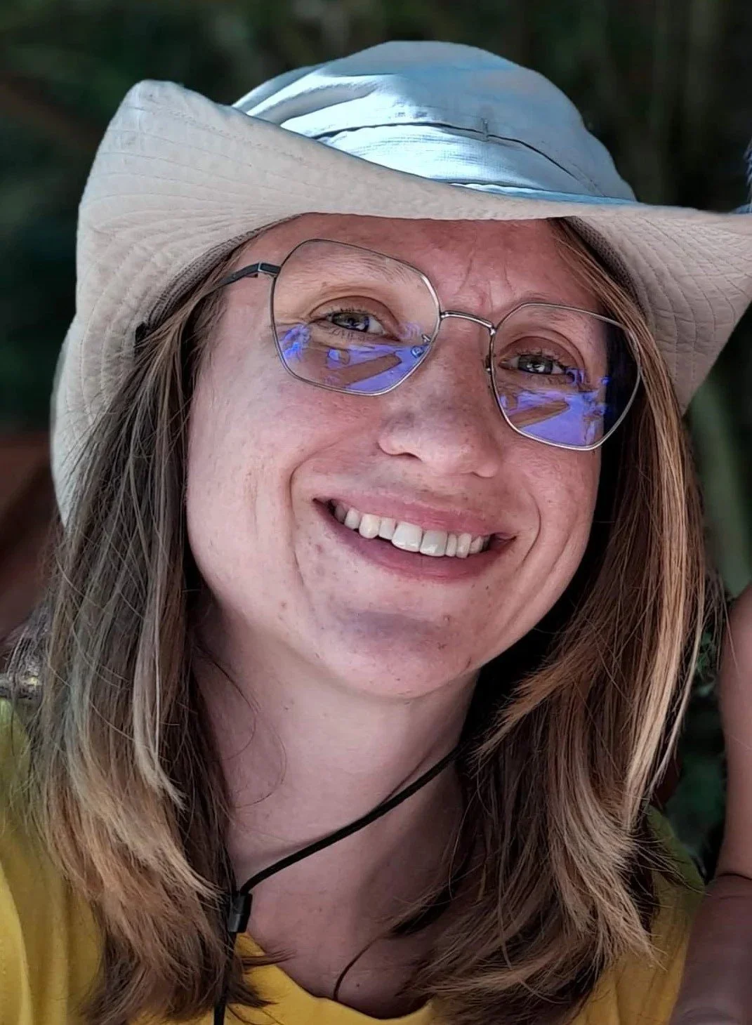 Black and white cartoon illustration of a magnifying glass and a person looking through it.