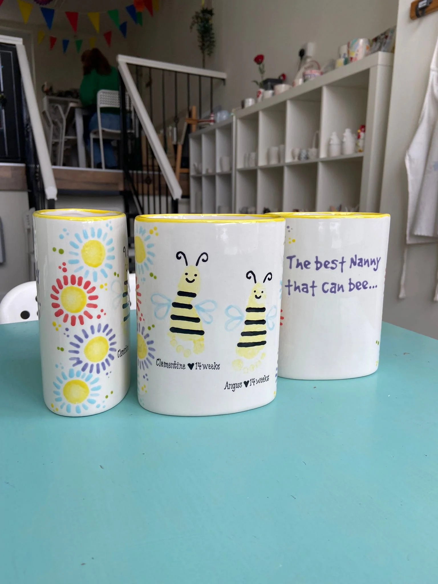 Baby footprints on vases. We add details to the print depending on what design the customer wants. Illustrations and wording are added accordingly