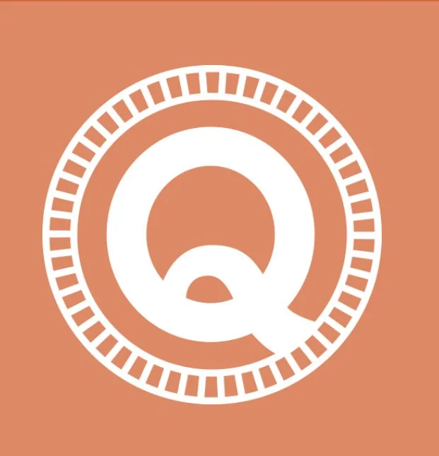 White stylized letter Q with a small circle below it, enclosed in a circle with tick marks on a brown background.