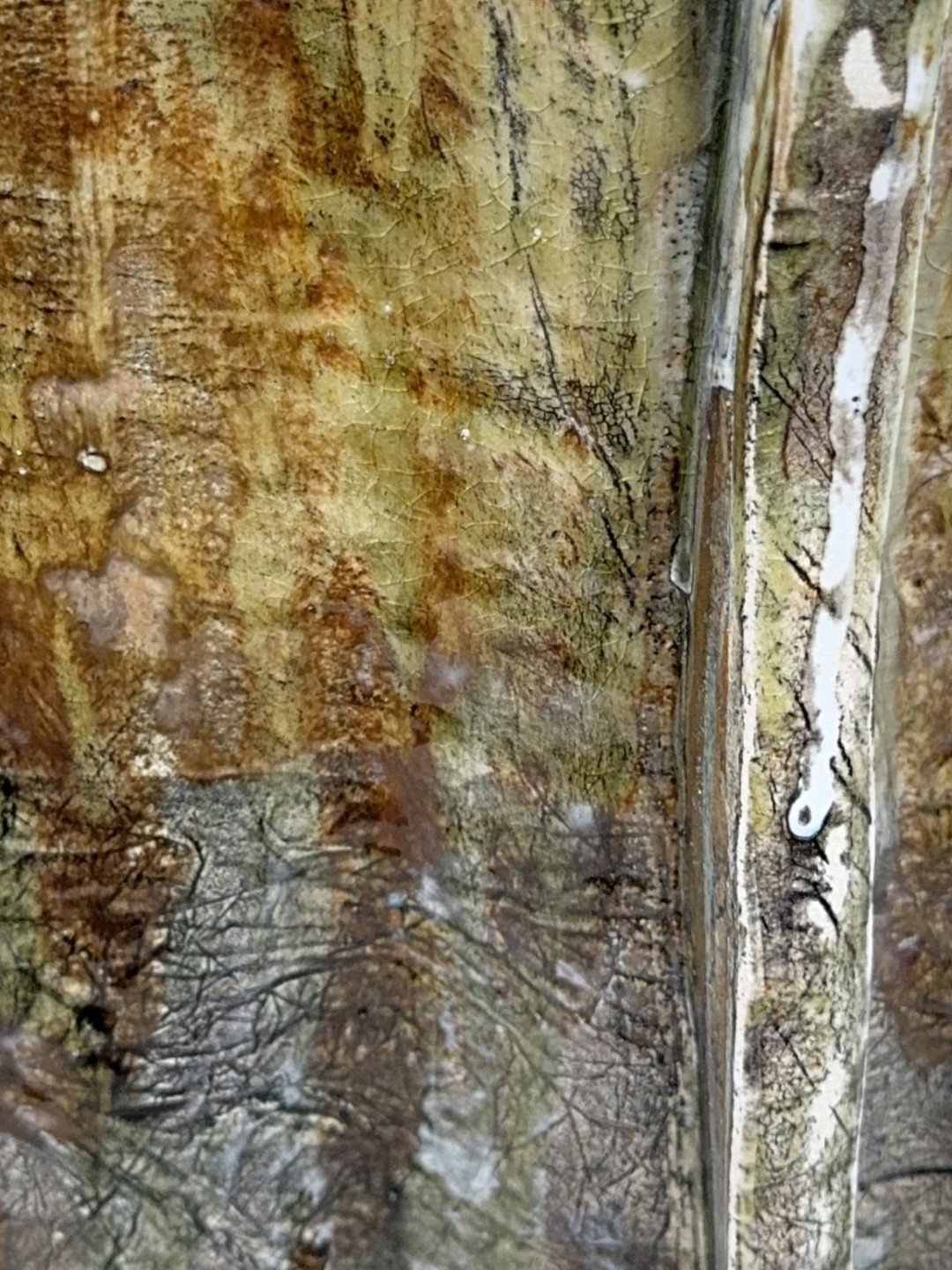 Close-up view of the back of Rooftile by ceramic Artist Cristina Lorenzet, a unique handmade stoneware sculpture.