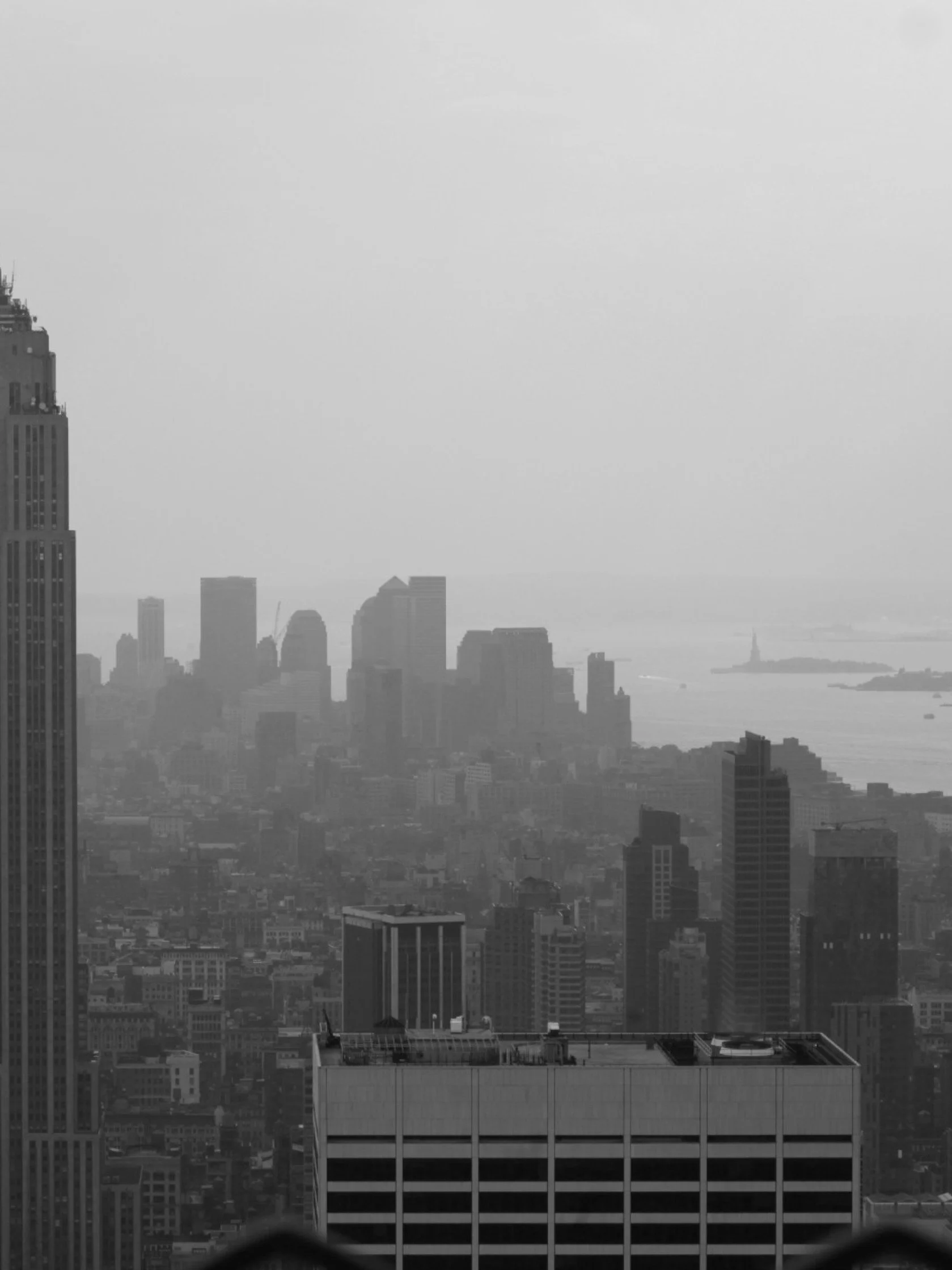 Roof with a view, a photograph by Carlos Lumiere, right side of artwork, a moment of inspiration at the Rockefeller Center.