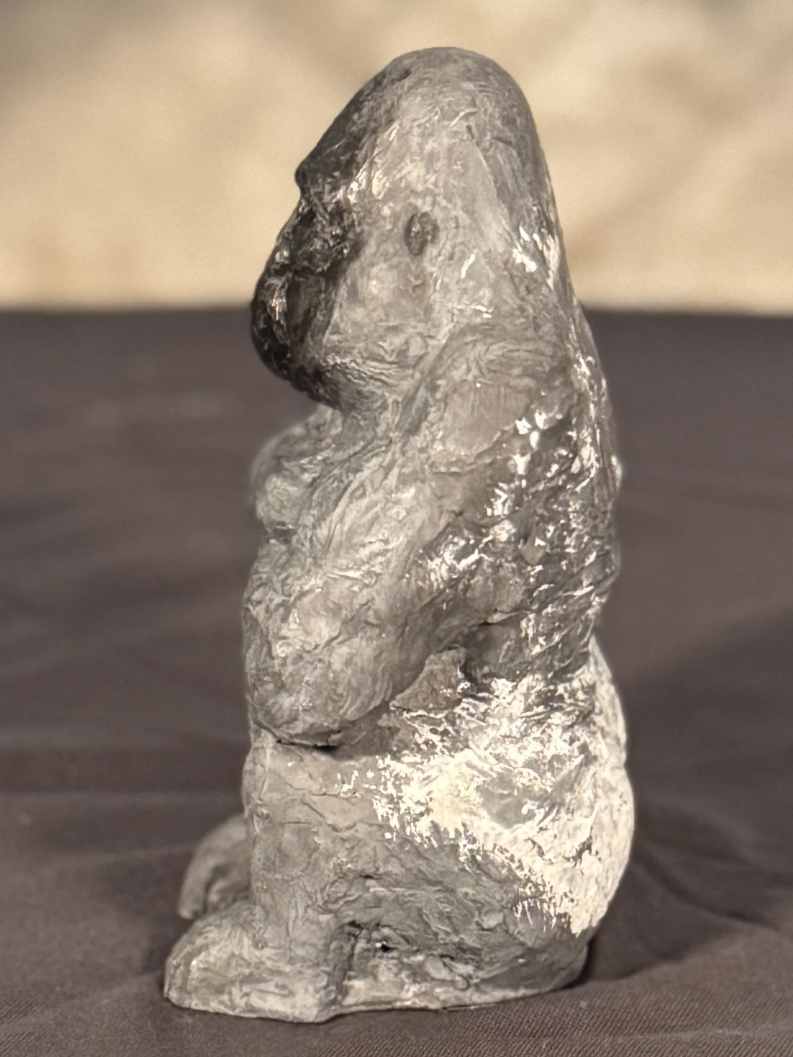Side view of Seated Silverback sculpture by Julien Hipeau, cast in Jesmonite, a sustainable resin chosen for its fine detail.