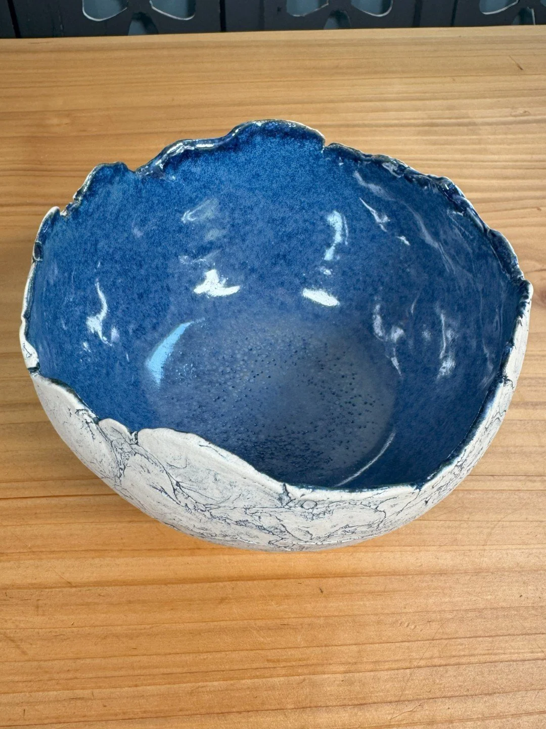 Top view of large crackle bowl with pedestal by Artist Nupur Narain DeTar, a unique hand-crafted stoneware with blue pigment.