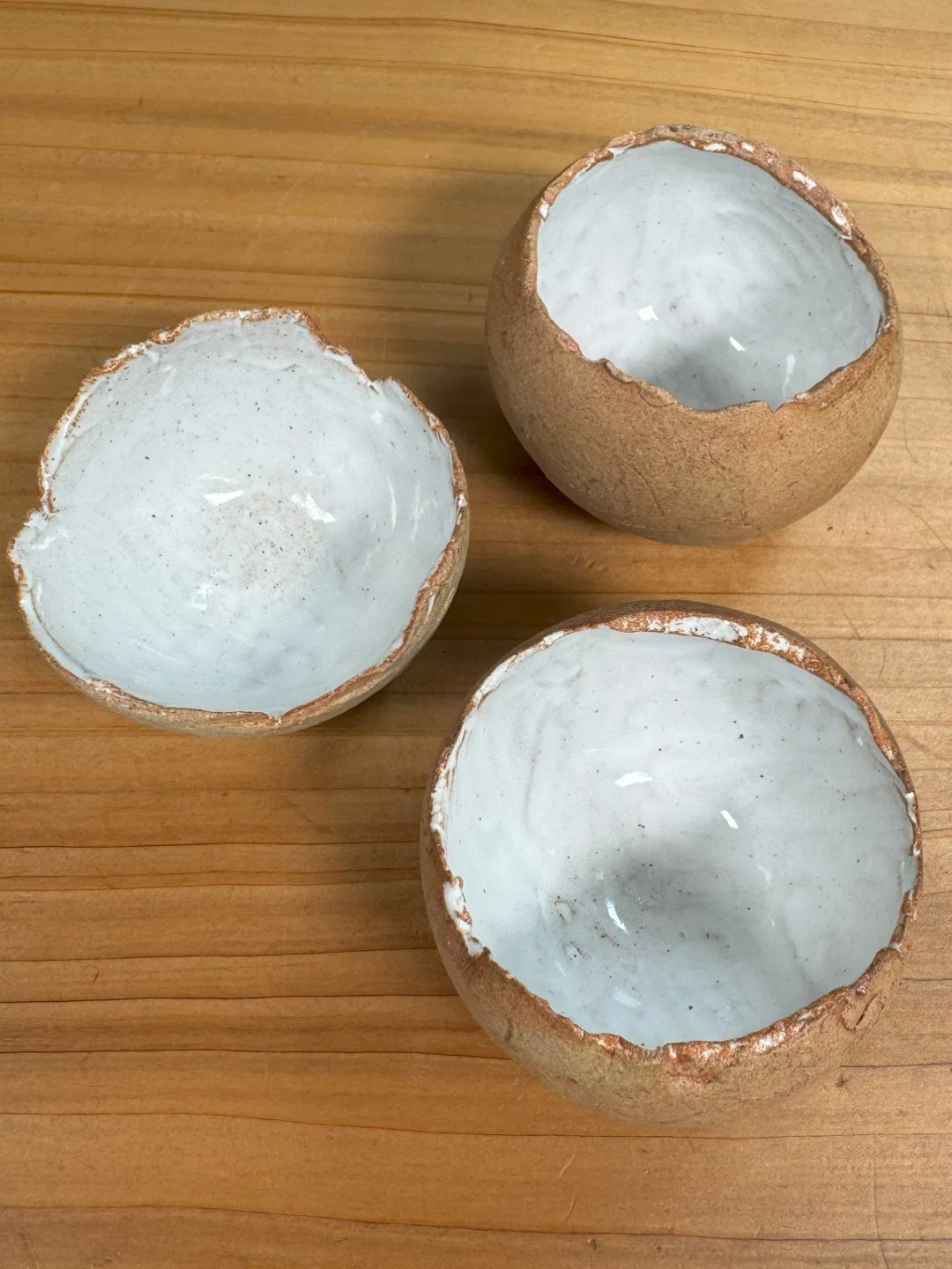 Top view of small handmade crackle bowl by ceramic Artist Nupur Narain DeTar, with food-safe glaze inside.