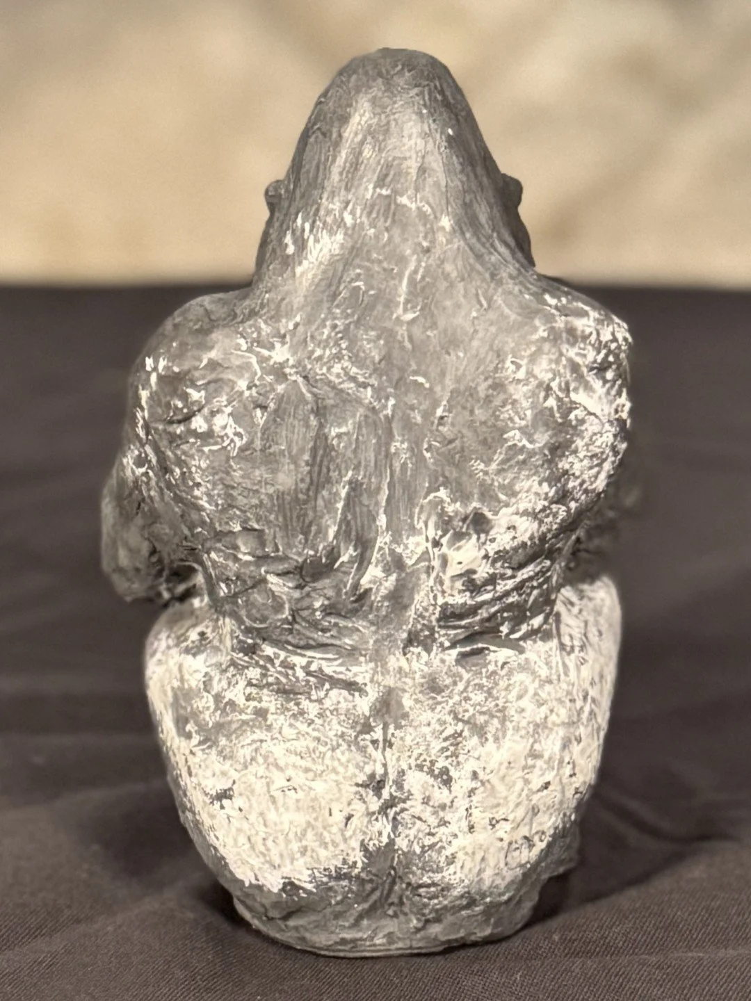 Back view of Seated Silverback by Julien Hipeau, a beautiful sculpture of a gorilla cast in Jesmonite, a sustainable resin.