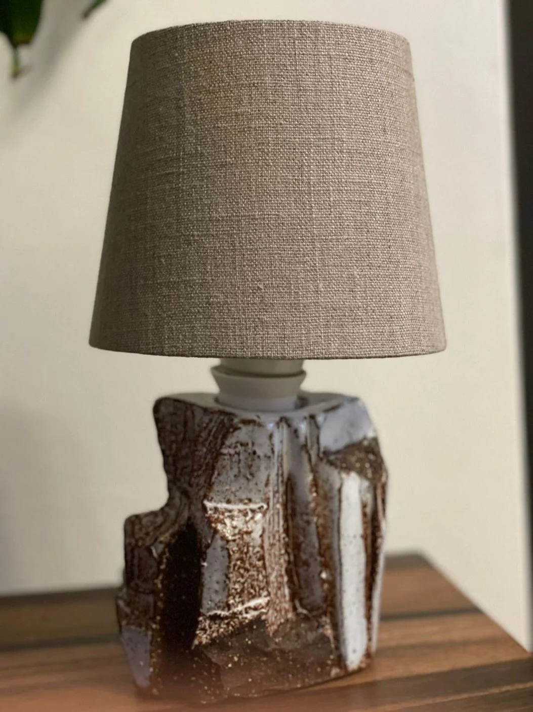 Kurinuki lamp by ceramic Artist Nupur Narain DeTar, hand-carved base, high-fired, with beautiful lampshade by Jim Lawrence.