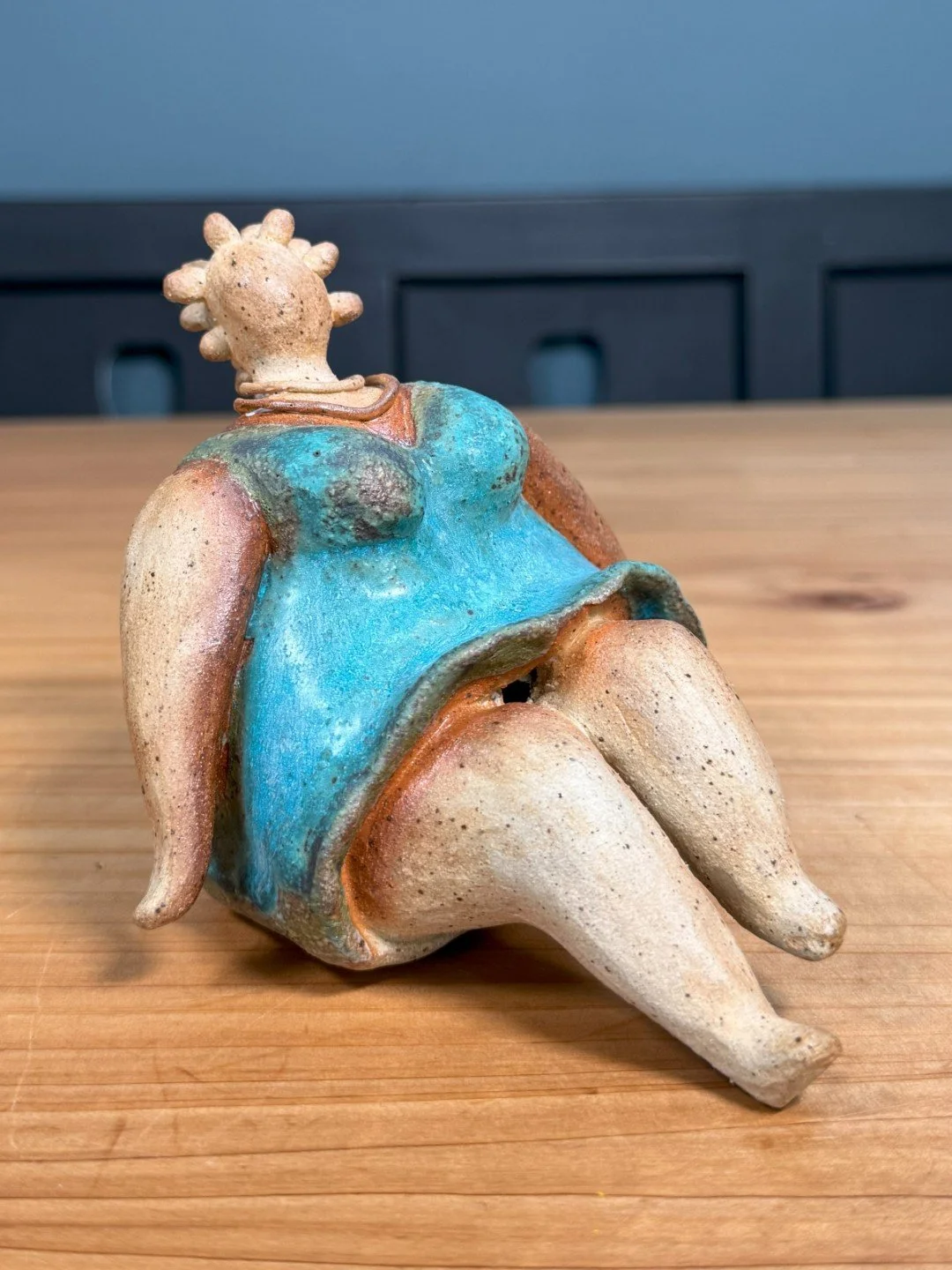 Sitting lady in a dress