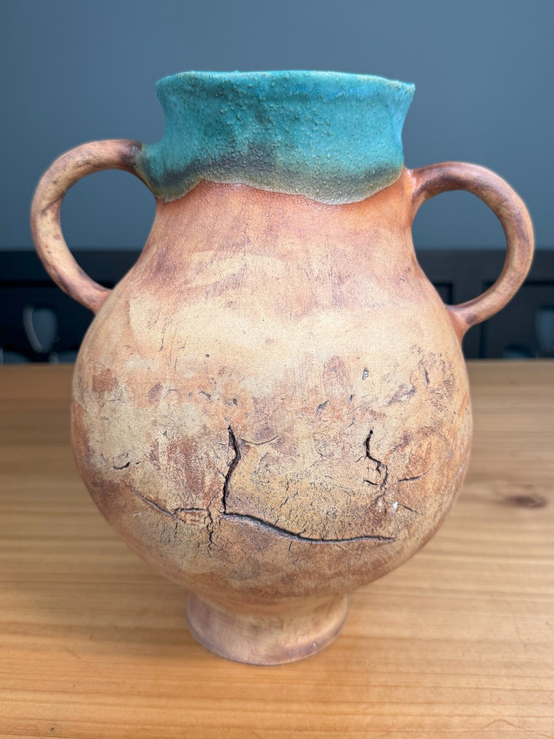 Large handbuilt ceramic vase by Artist Nupur Narain DeTar, coil-built with turquoise glaze inside and iron oxide outside.