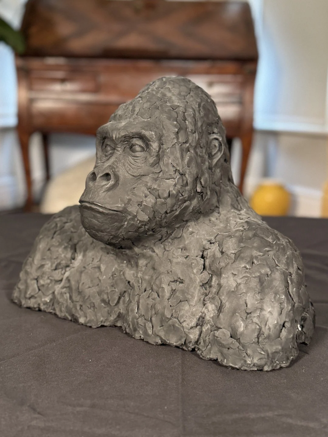 Side view of Gorilla Bust, a sculpture by Artist Julien Hipeau, cast in Jesmonite.