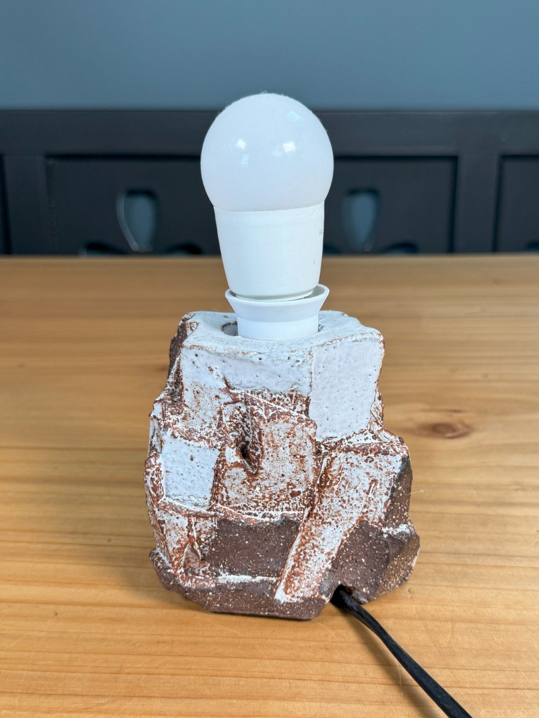 Back view of Kurinuki lamp by ceramic Artist Nupur Narain DeTar, hand-carved and high-fired base.