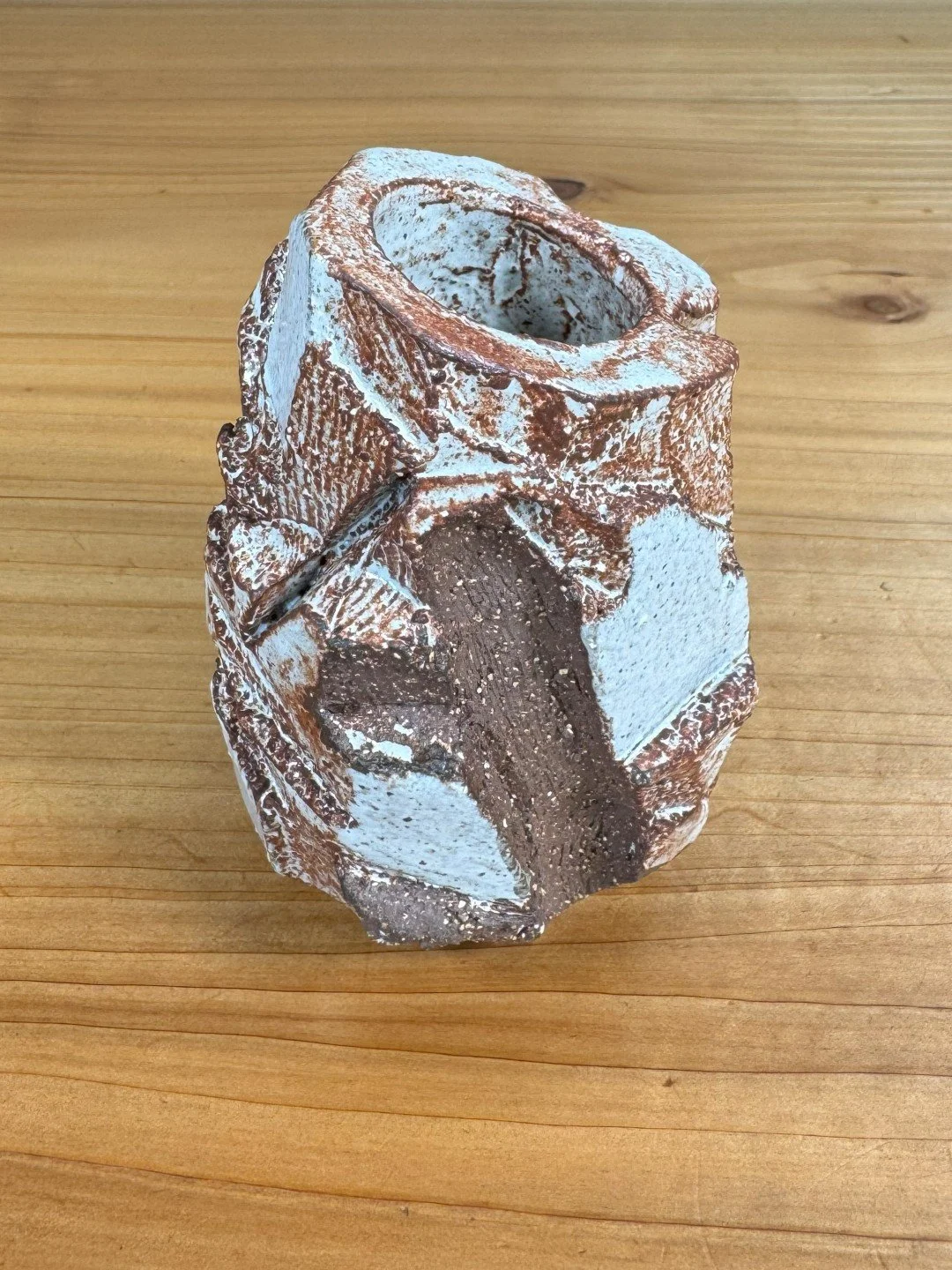 angle view of Kurinuki vase by ceramic Artist Nupur Narain DeTar, hand-carved, glazed and high-fired.