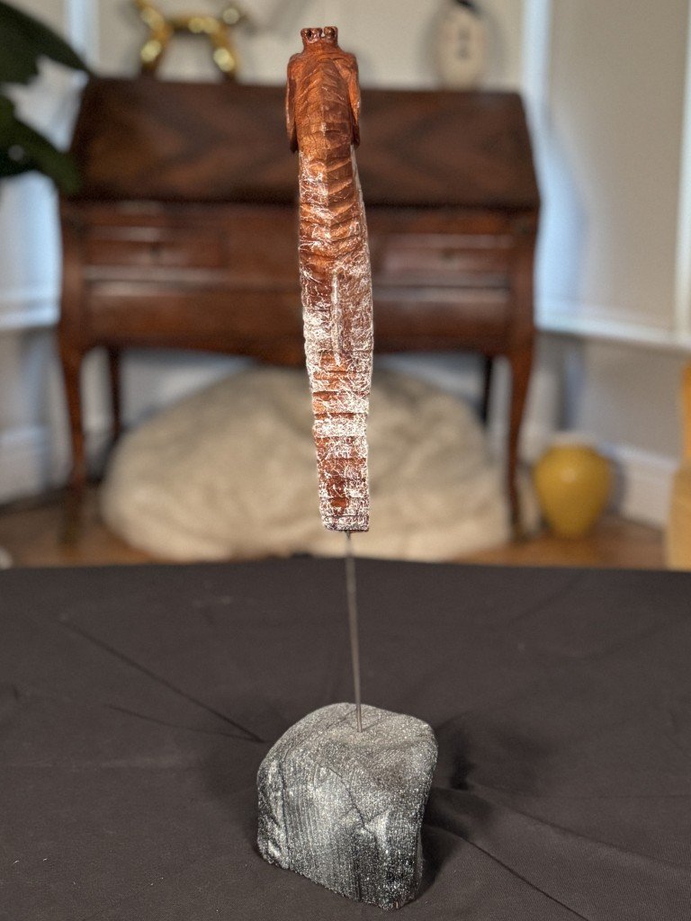 Back view of Skinny Seahorse by Julien Hipeau, a wooden sculpture carved from a reclaimed window sill.