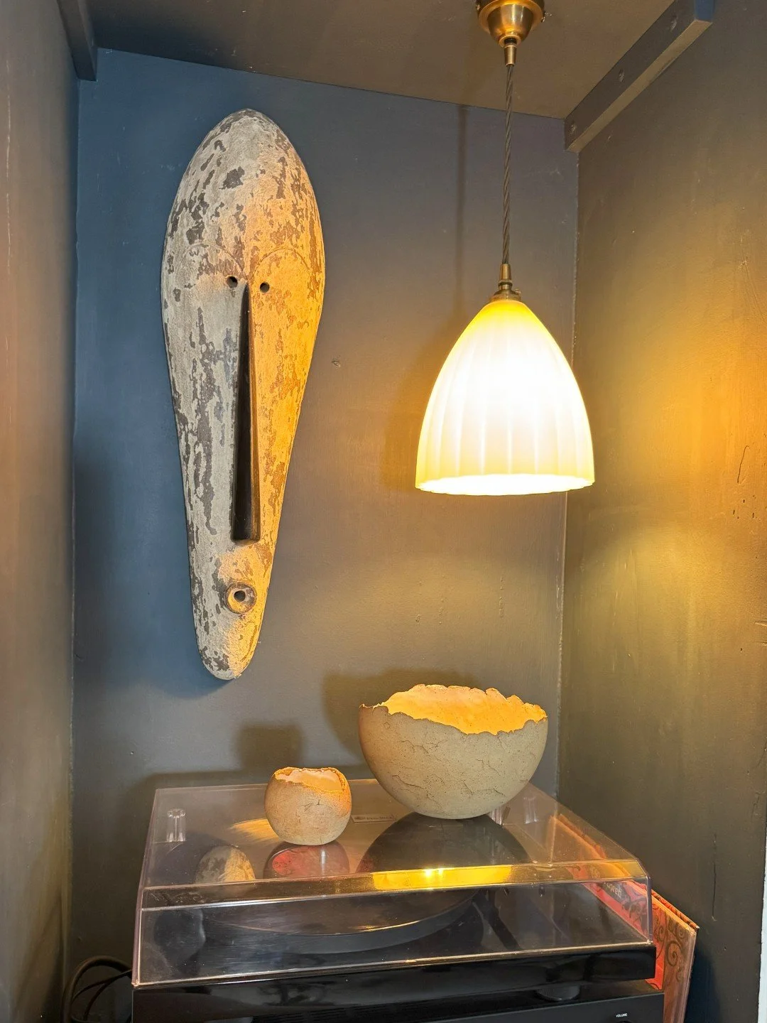 Beautiful hand-built crackle bowl by ceramic Artist Nupur Narain DeTar, displayed with other objects in a house.