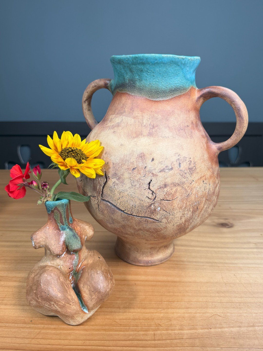 Large hand-crafted ceramic vase by Artist Nupur Narain DeTar, displayed with sitting lady vase sculpture.