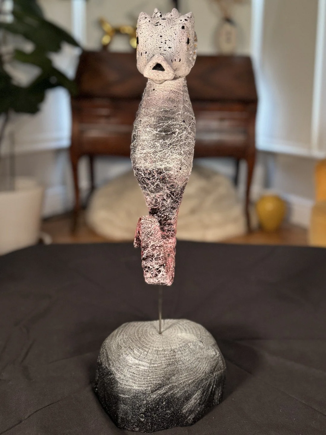 Seahorse sculpture by Artist Julien Hipeau, front view of the cast of a charred wooden seahorse, with grain and texture.