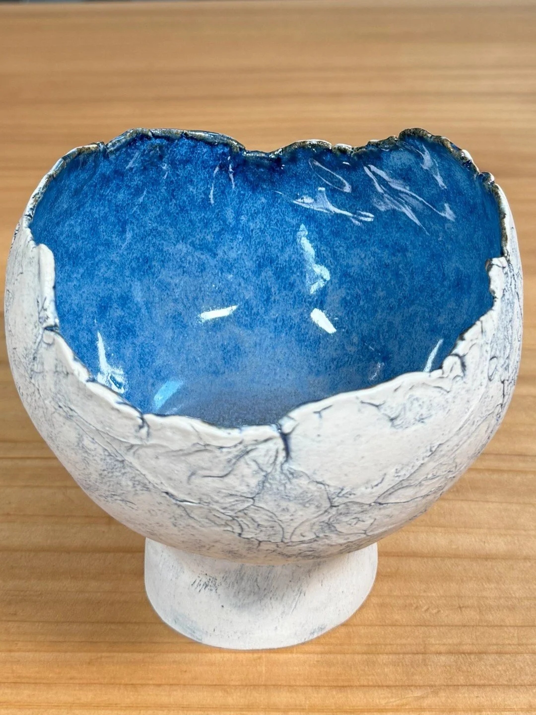 Top view of medium crackle bowl with pedestal by Artist Nupur Narain DeTar, a unique handcrafted stoneware with blue pigment.