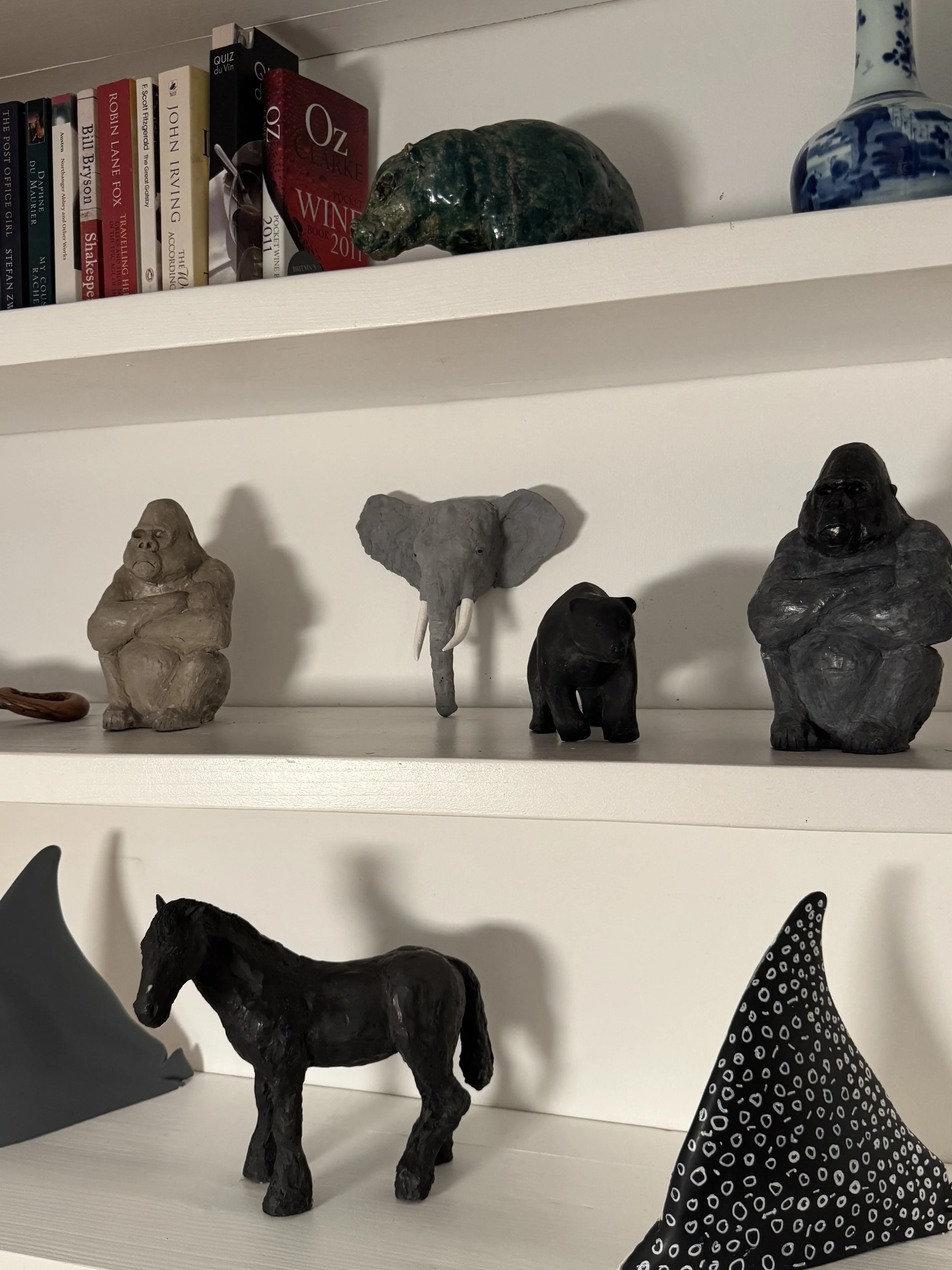 Elephant Head Template by Julien Hipeau, a preparatory study, displayed on a shelf with other artworks from the artist.