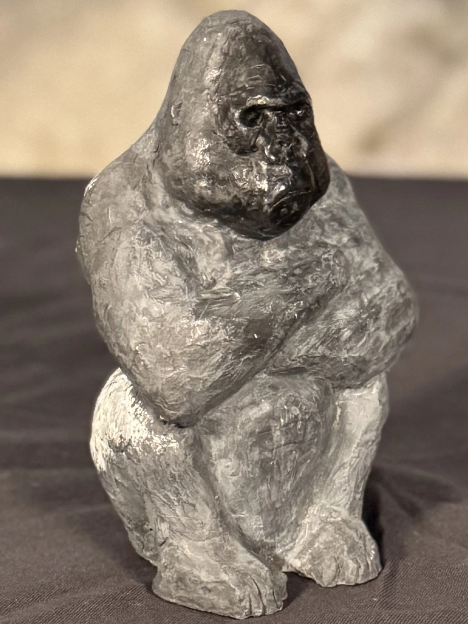 Seated Silverback sculpture by Artist Julien Hipeau, cast in Jesmonite, a sustainable and durable resin.