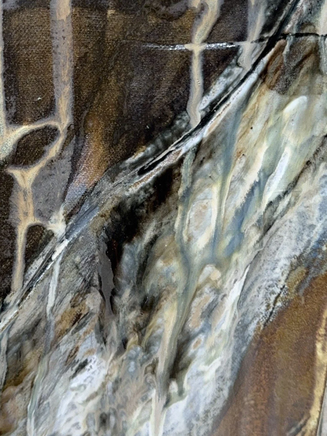 Close-up of the front of Rooftile by ceramic Artist Cristina Lorenzet, a unique sculpture with stunning texture and colours.