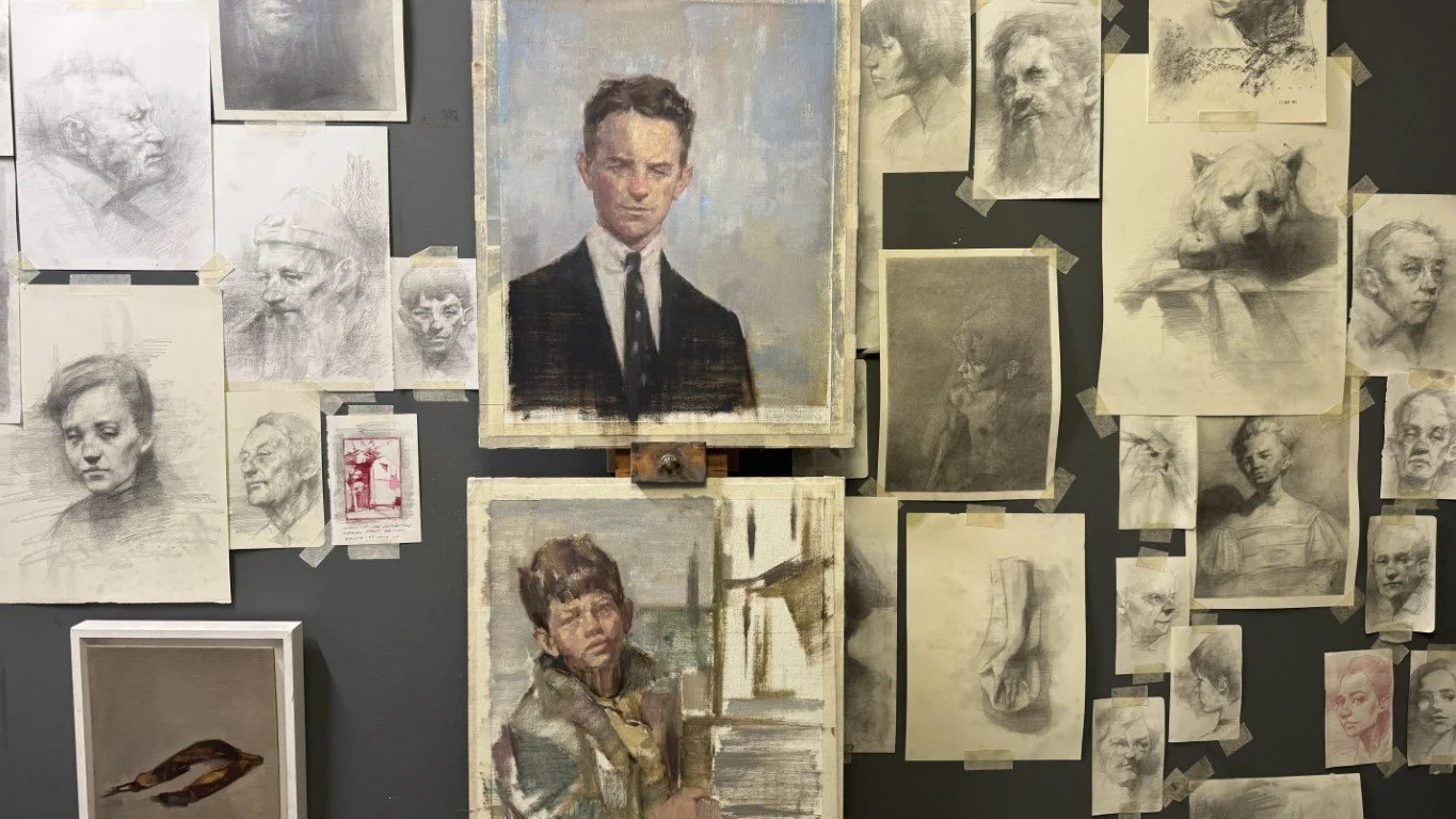 Studio wall featuring original drawings and oil paintings by Artist Bran Sivas.