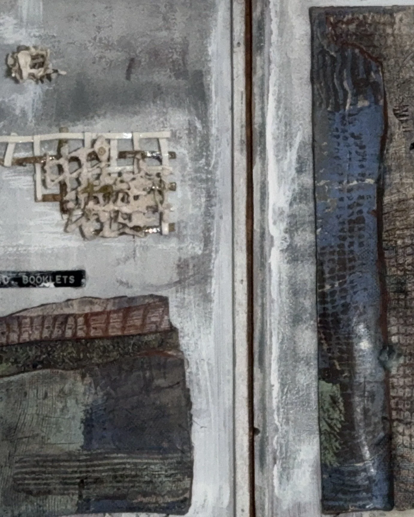 Closeup of quadriptych ceramic wall art sculpture by Artist Cristina Lorenzet.