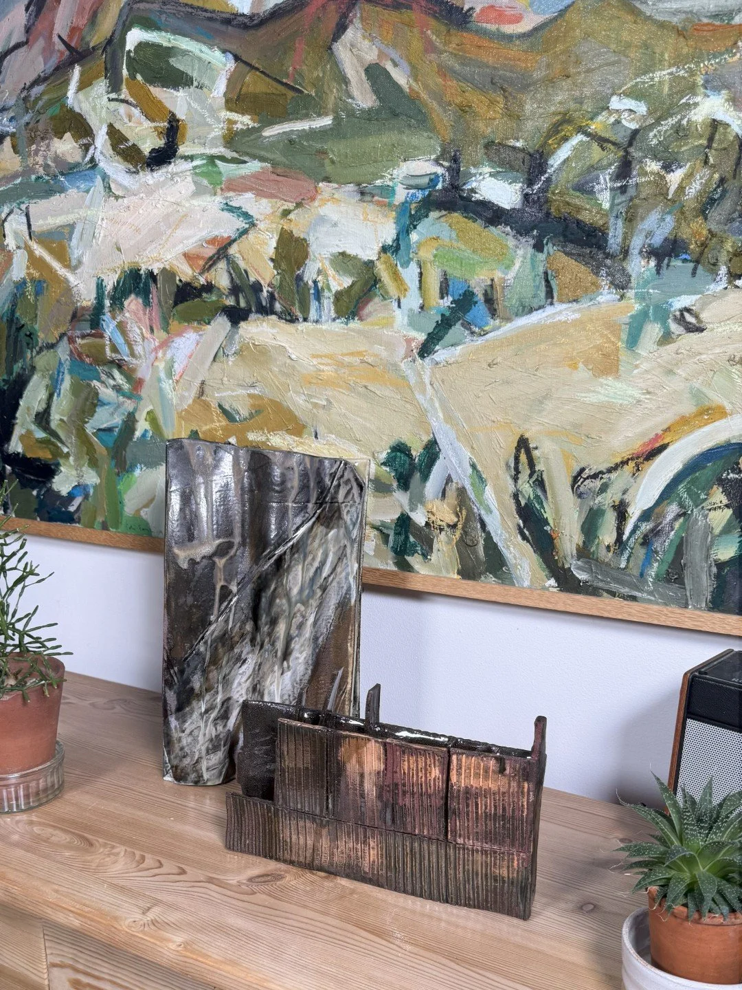 Rooftile by ceramic Artist Cristina Lorenzet, a unique handmade stoneware sculpture displayed with Skyline 1 artwork.