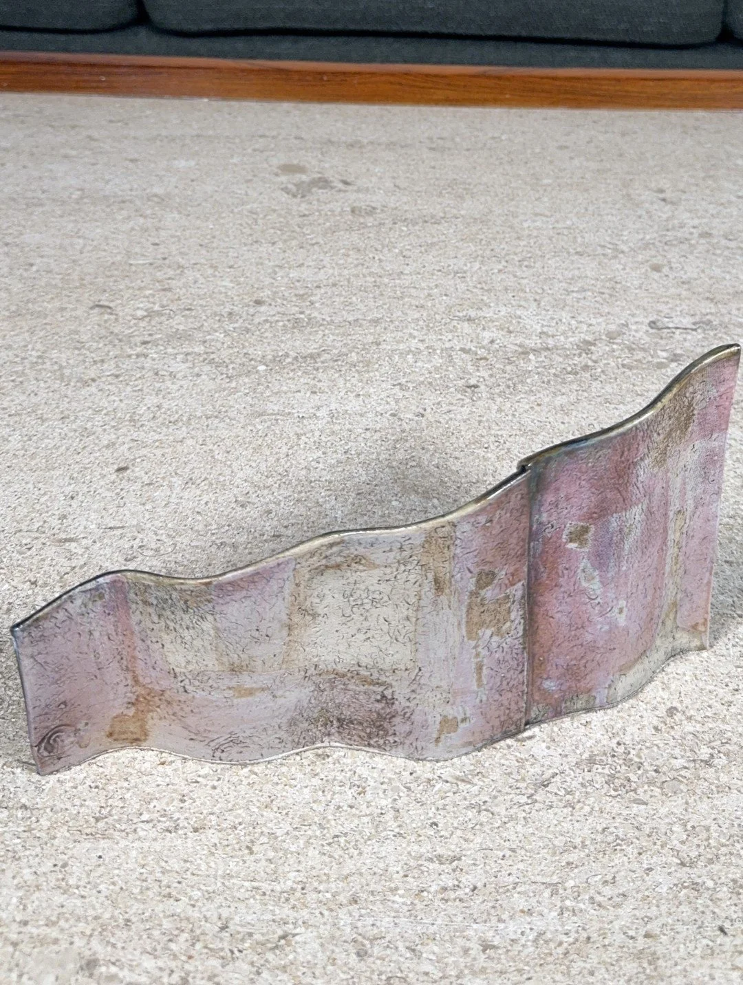 Rooftile fragment 2 sculpture by Artist Cristina Lorenzet, the reverse is decorated with manganese dioxide and a tin glaze.