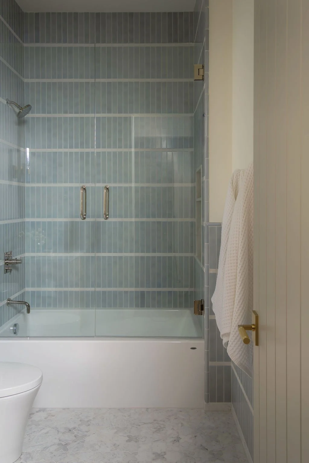 lake-oswego-lakeview-home-guest-en-suite-bathroom-light-blue-tile.jpg