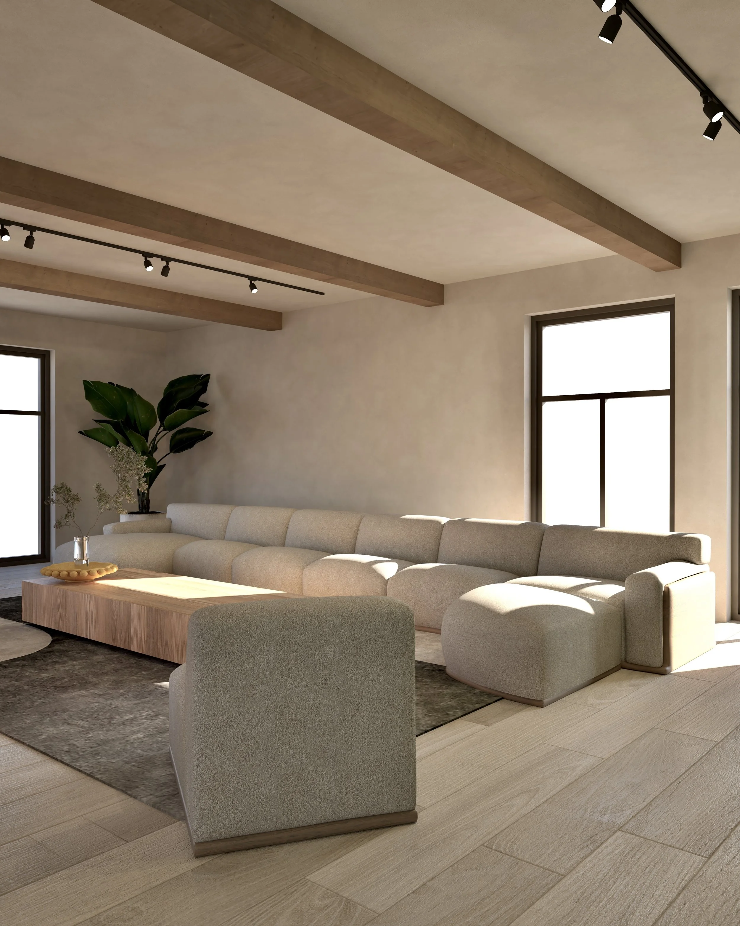 Lichte woonkamer met grote loungebank, salontafel, plant en ramen.