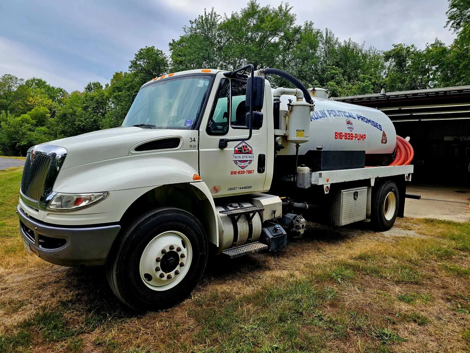 Twin Springs Septic Services truck in front of the shop