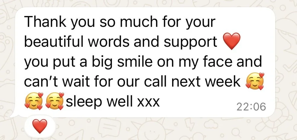 A messaging app chat bubble with a thank you message, emojis including hearts and smiley faces, and a timestamp of 22:06.