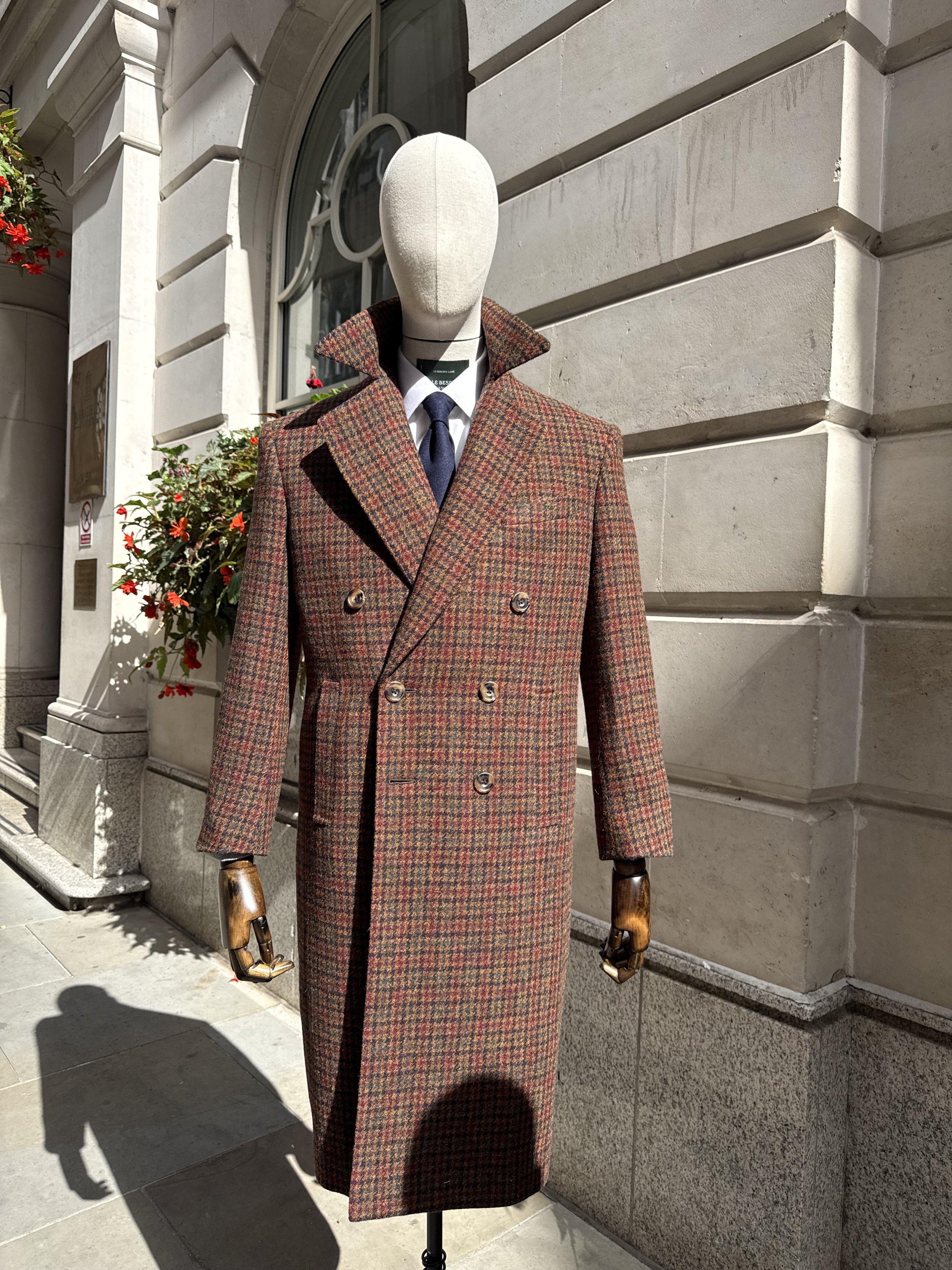 Bespoke double-breasted overcoat in Holland & Sherry Harris Tweed, featuring a richly textured brown, rust and navy check, handcrafted by Kale Bespoke in the City of London.