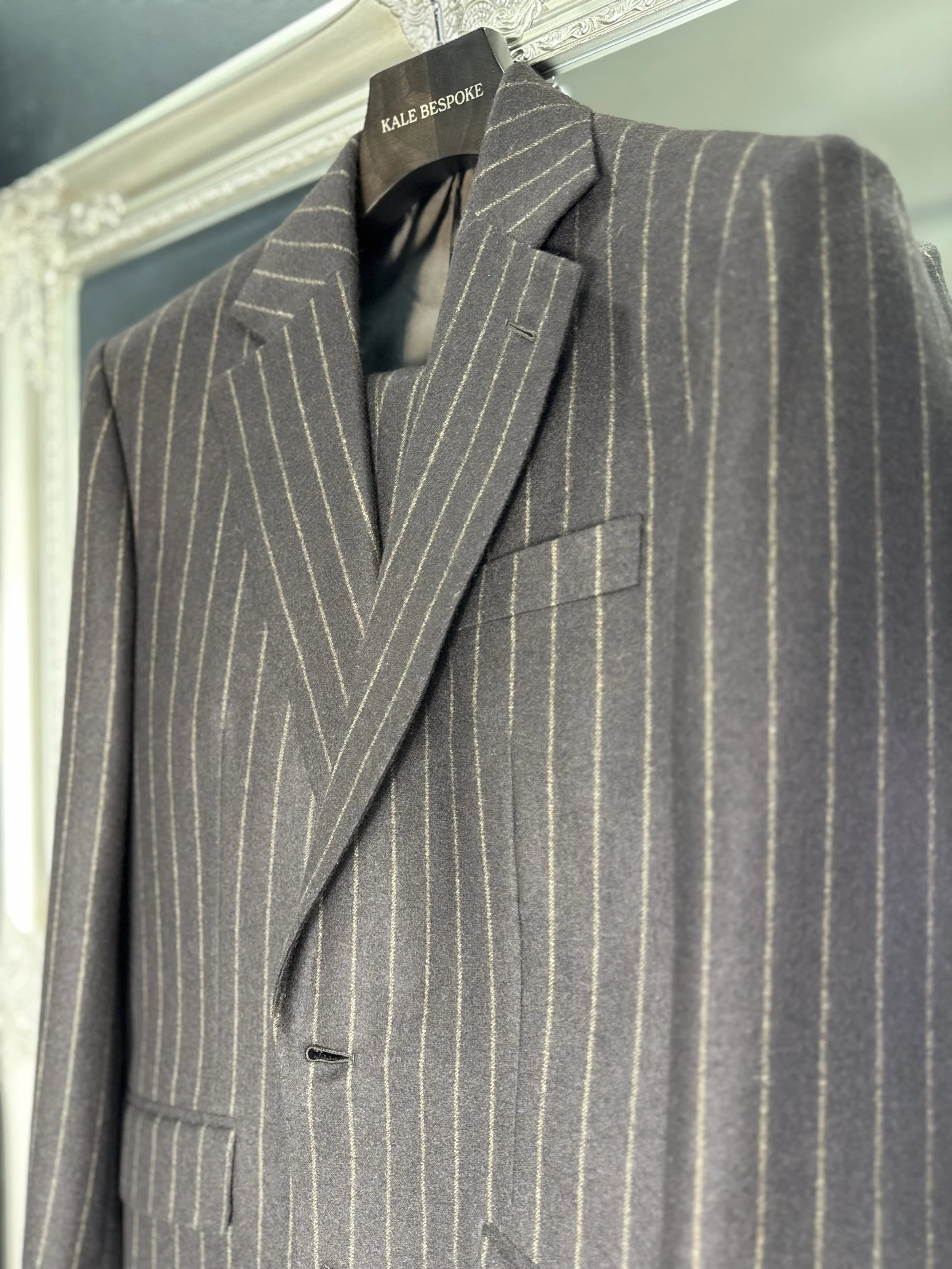 Brown flannel chalk stripe suit from standeven uxbridge flannel bunch 12oz.Two piece bespoke suit by Kale bespoke showcase inside our store.