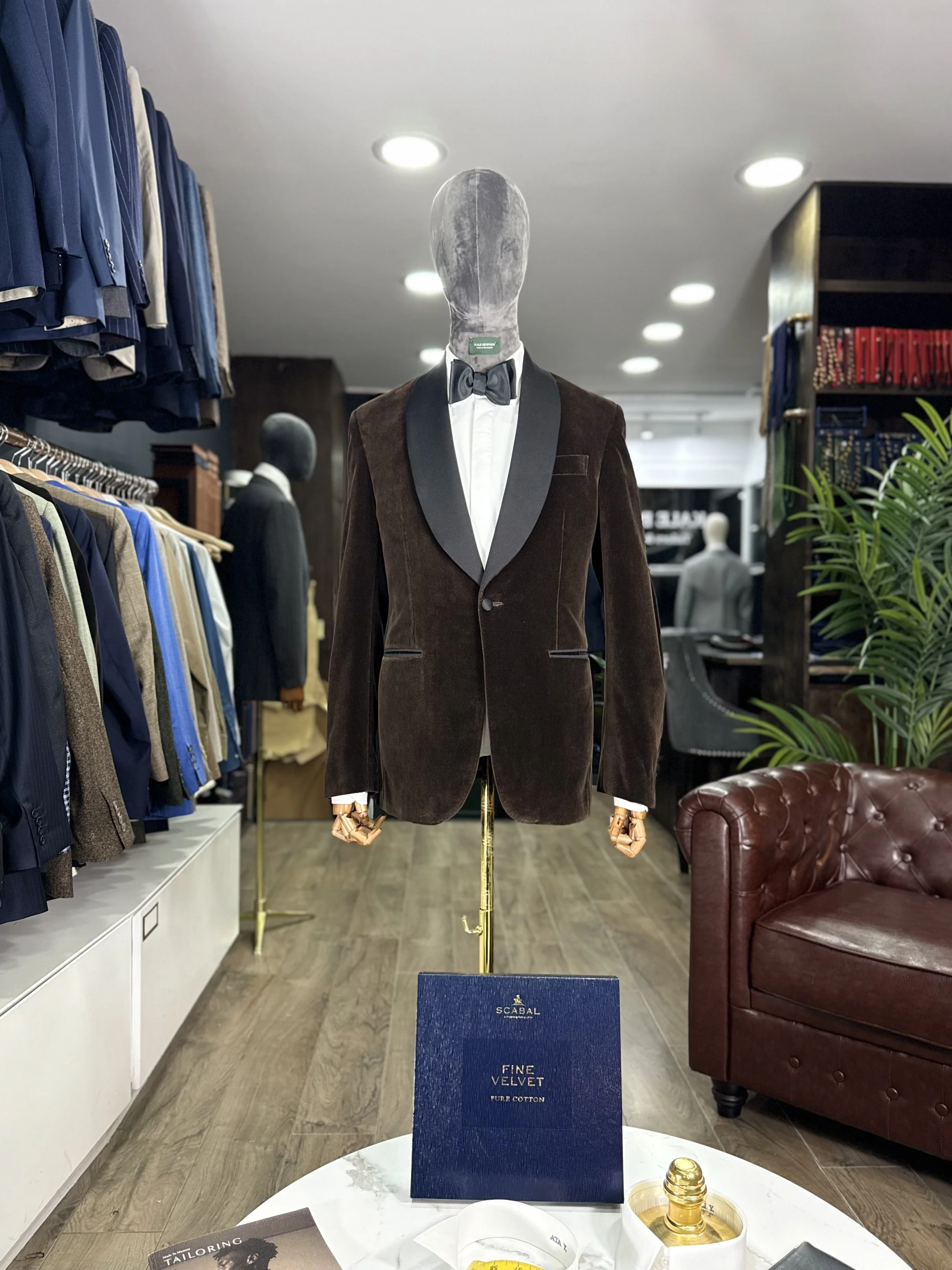 Bespoke Scabal brown velvet tuxedo jacket with black silk shawl lapel, styled with a marcella front dress shirt and bow tie.Made and fitted in our City of London tailoring house near Bank.

