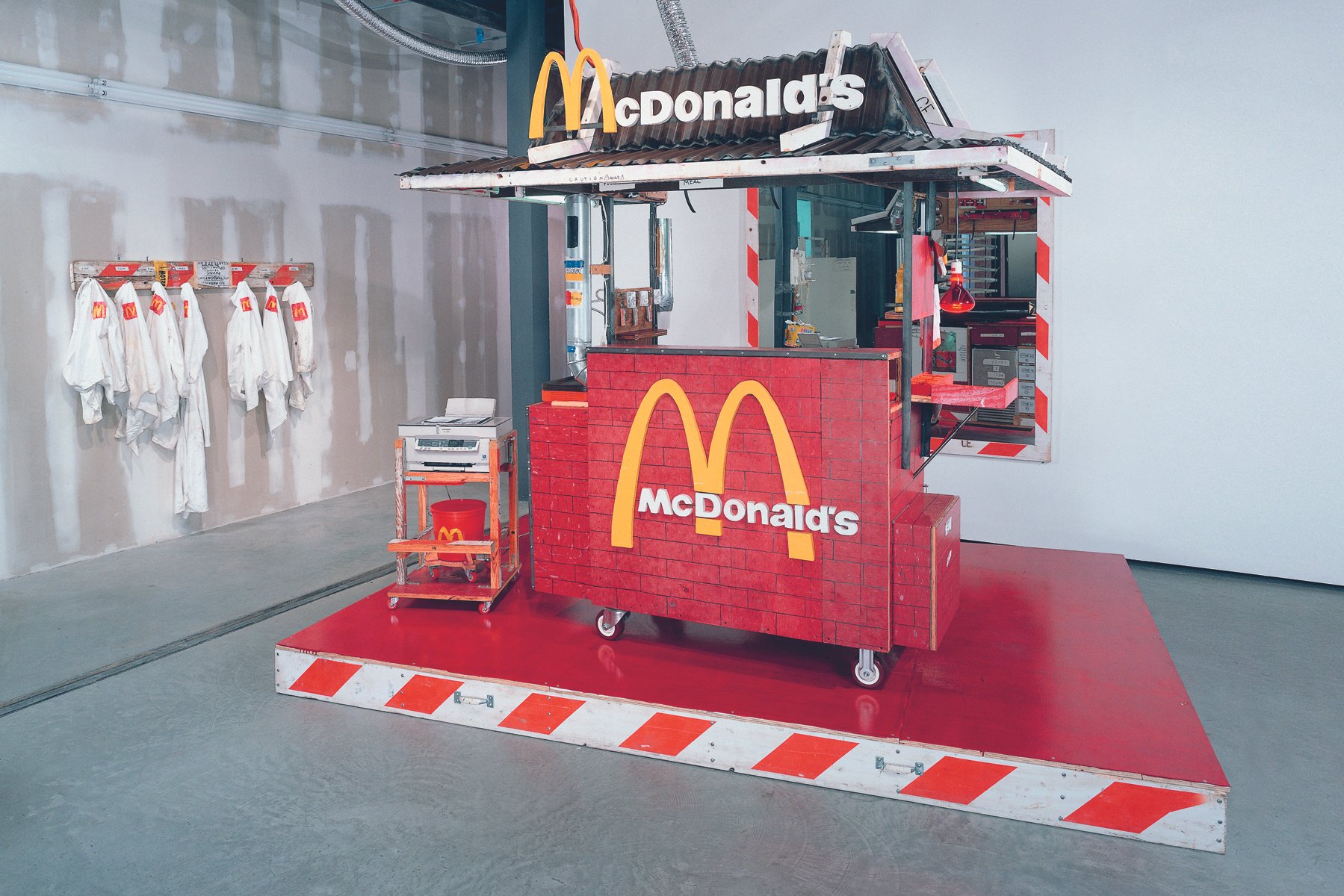  Tom Sachs,  Nutsy’s McDonald’s , 2001. Artwork © Tom Sachs (pages 336-337) Plywood, latex, steel, ConEd barrier, photocopier, found objects, and hardware; 96 × 74 × 72 in. 
