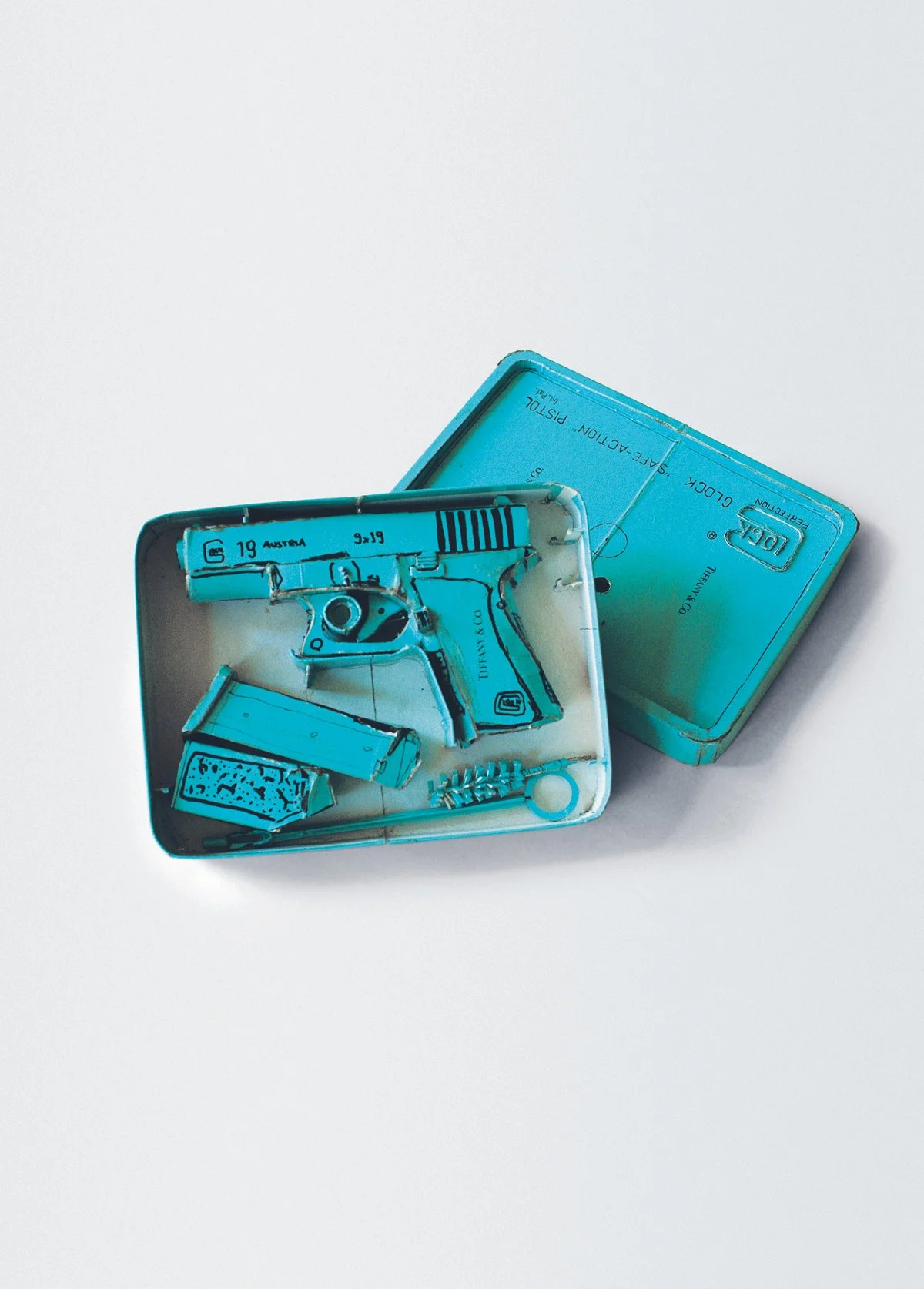  Tom Sachs,  Tiﬀany Glock Model 19 , 1995. Artwork © Tom Sachs (page 68) Ink and thermal adhesive on found cardboard; 2 1/2 × 6 1/2 × 9 in. 