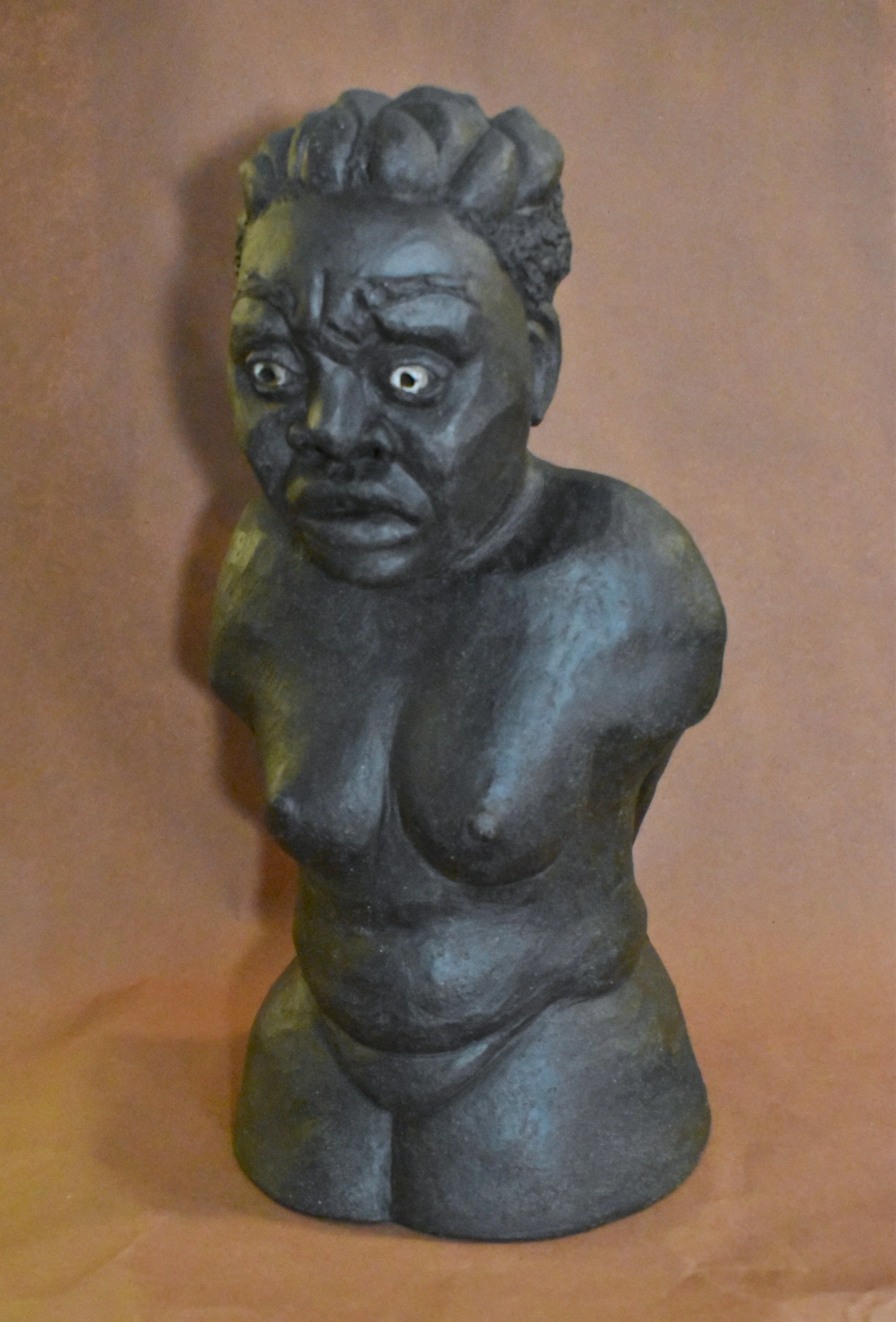 Black sculpture bust of a person 