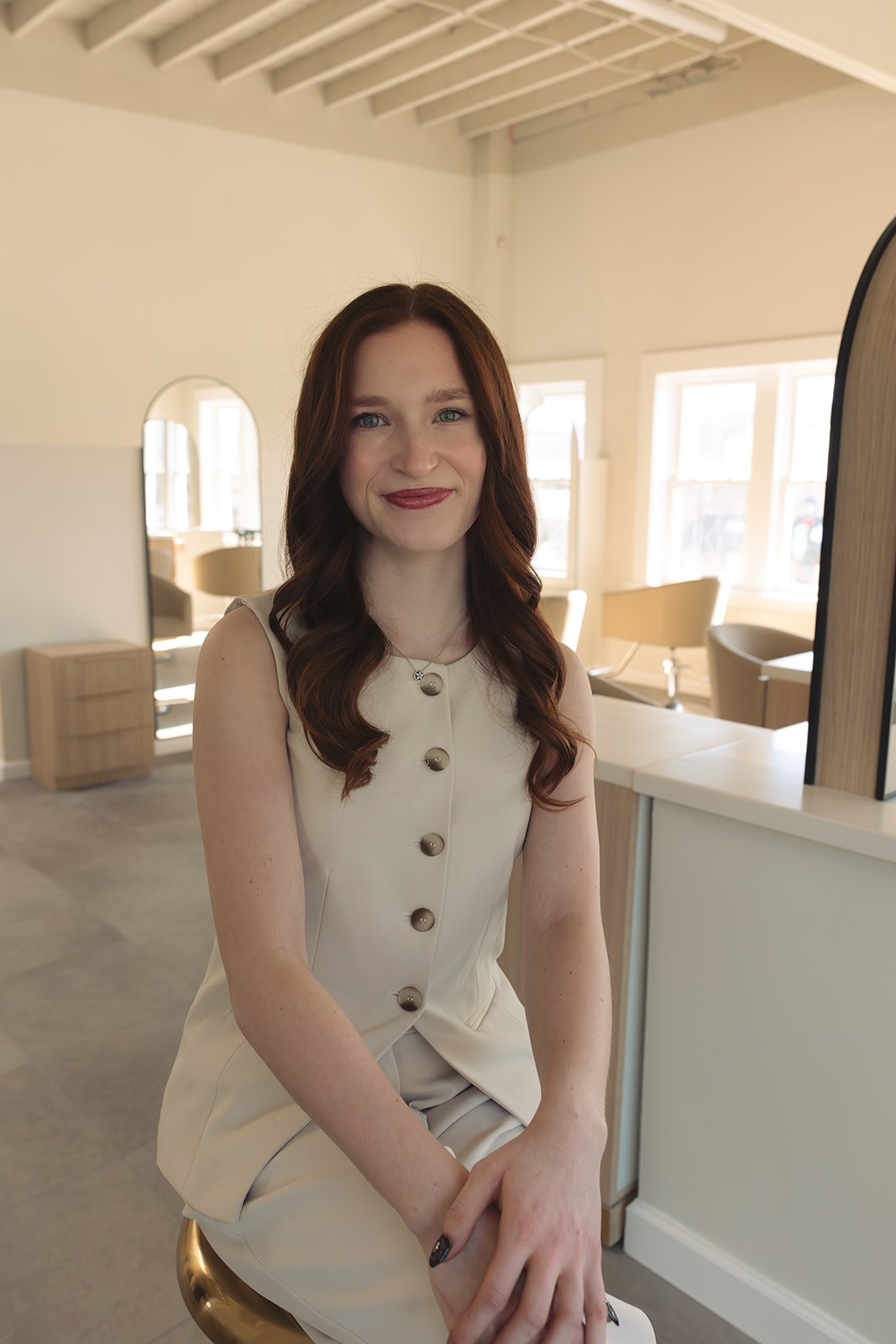 Lilly, a stylist at Bobbi specializing in bold hair color, precision haircuts and up-dos. 