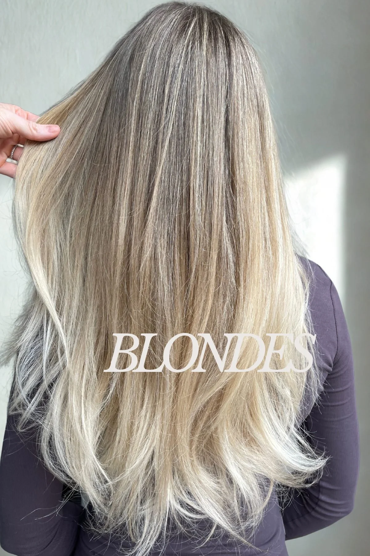 Back of a woman with long, layered blonde hair, labeled 'Blondes' in white text.
