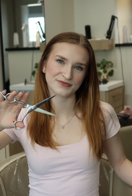 Lilly, a stylist at Bobbi specializing in bold hair color, precision haircuts and up-dos. 