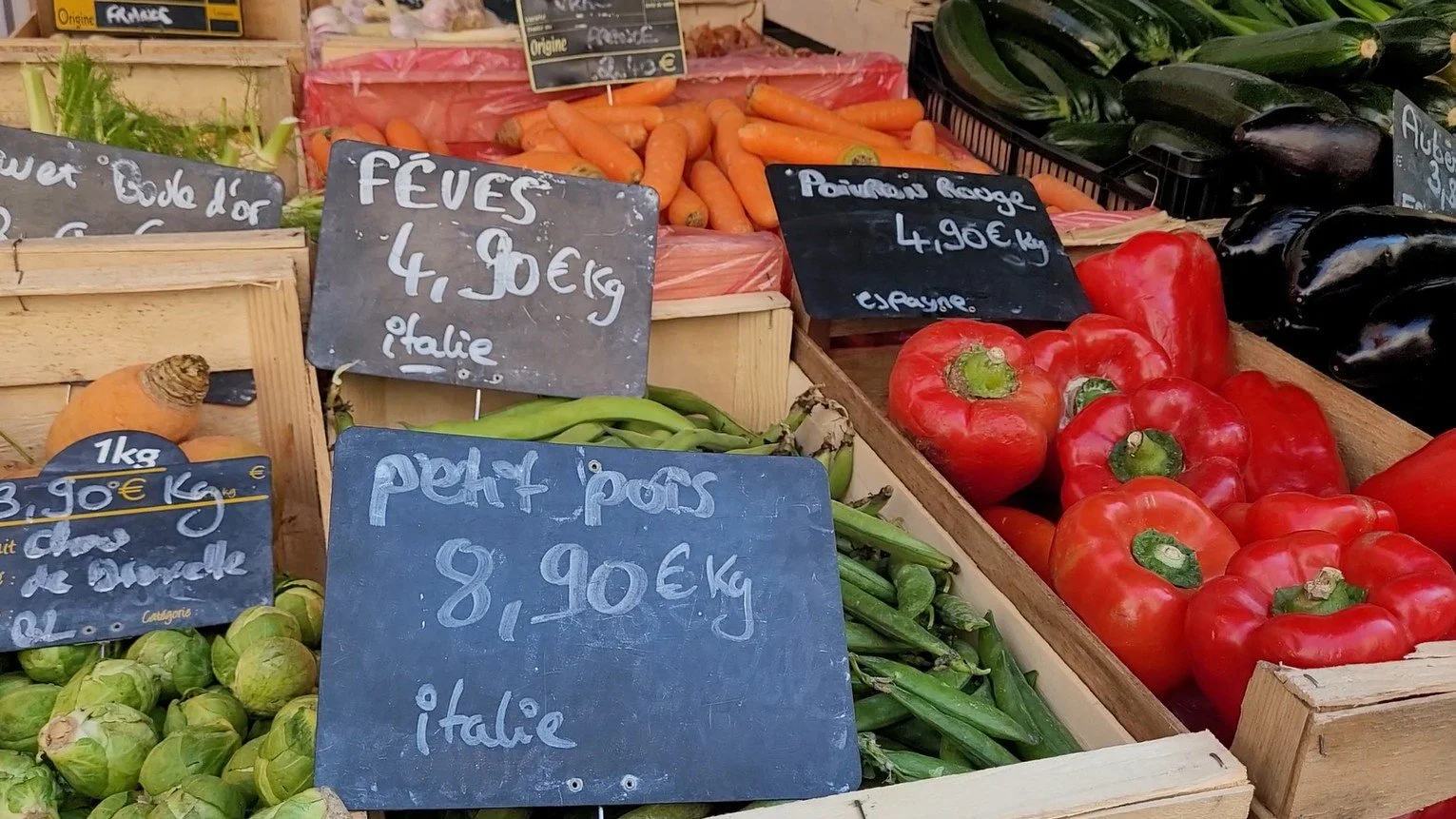 Market vegetables at Les Halles in Sète — fèves, petit pois, peppers, courgettes