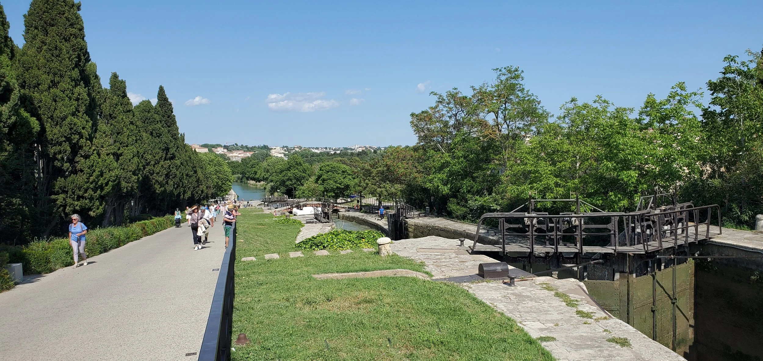 The Nine Locks of Fonseranes on the Canal du Midi with visitors on the paths above