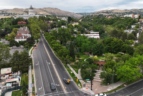 Aerial view of State Street in Salt Lake city with the Utah State Capitol building visible on a hilltop. This is a look at part of the future Pioneer Trail system. This trail will be similar to the Boston Freedom trail, but done to celebrate Utah.